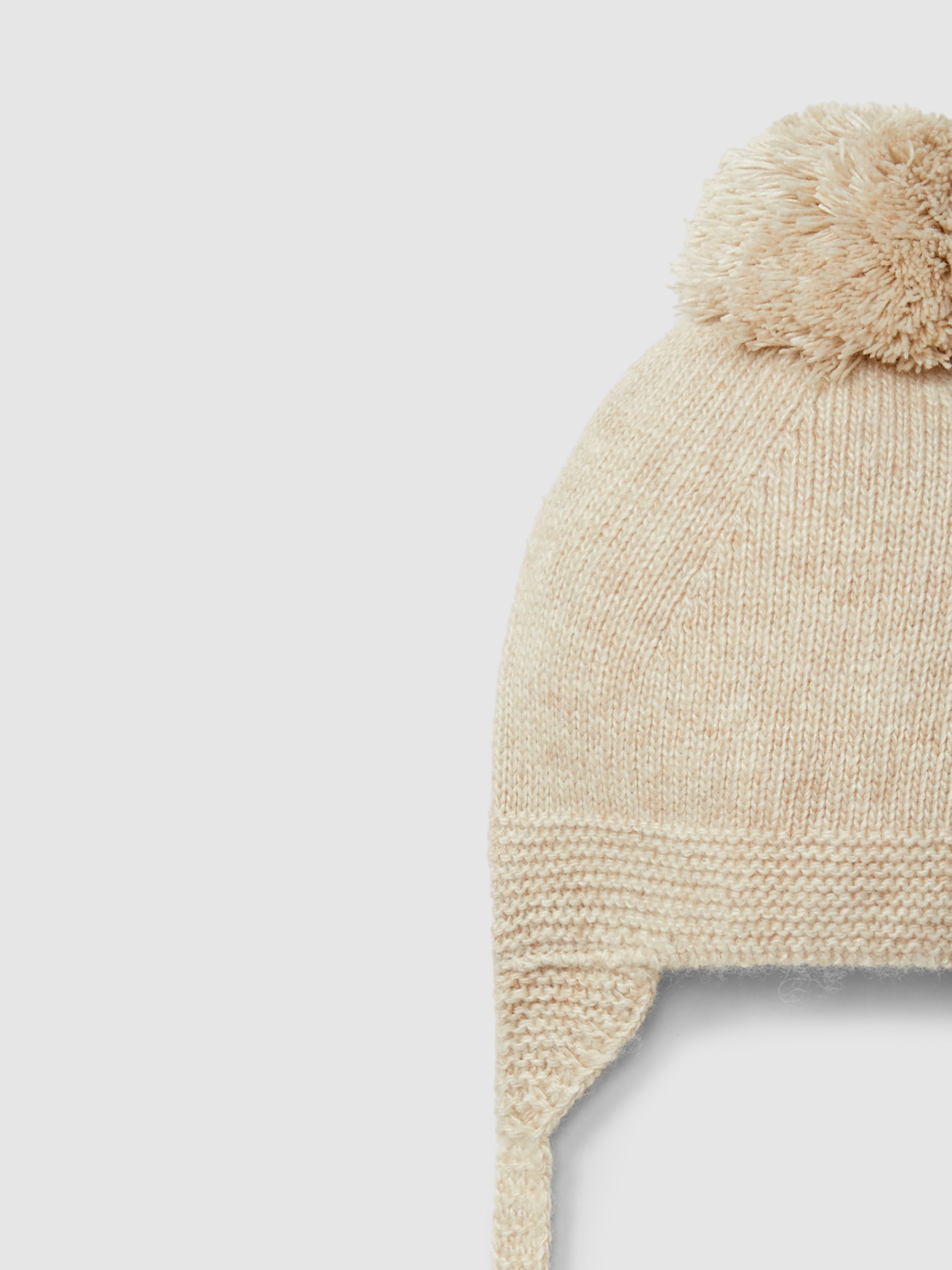 BONNET TRICOTE AVEC POMPON