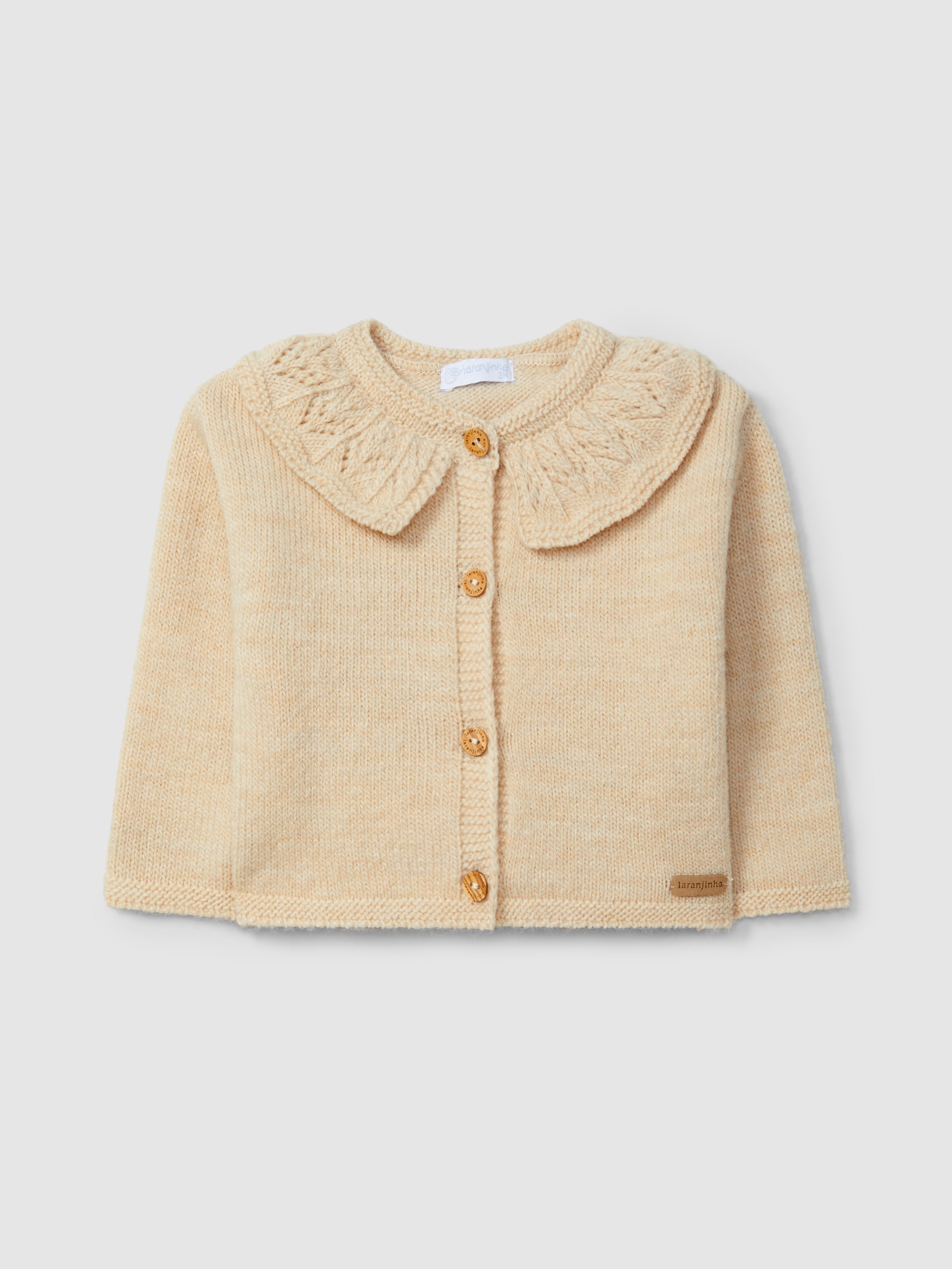 GILET TRICOTE A COL A VOLANT TRAVAILLE