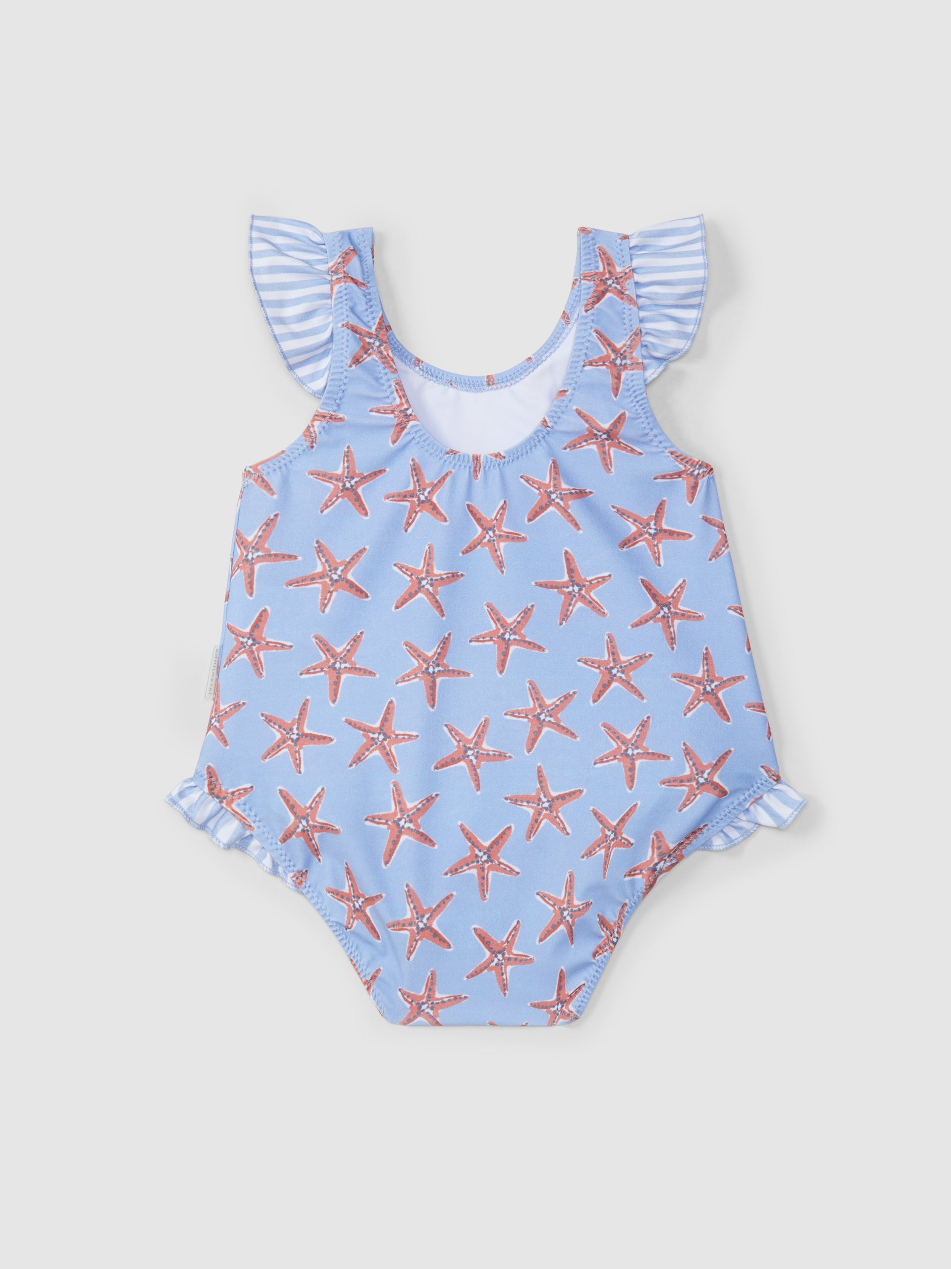 MAILLOT DE BAIN ETOILES DE MER ET DETAIL DE VOLANT A RAYURES
