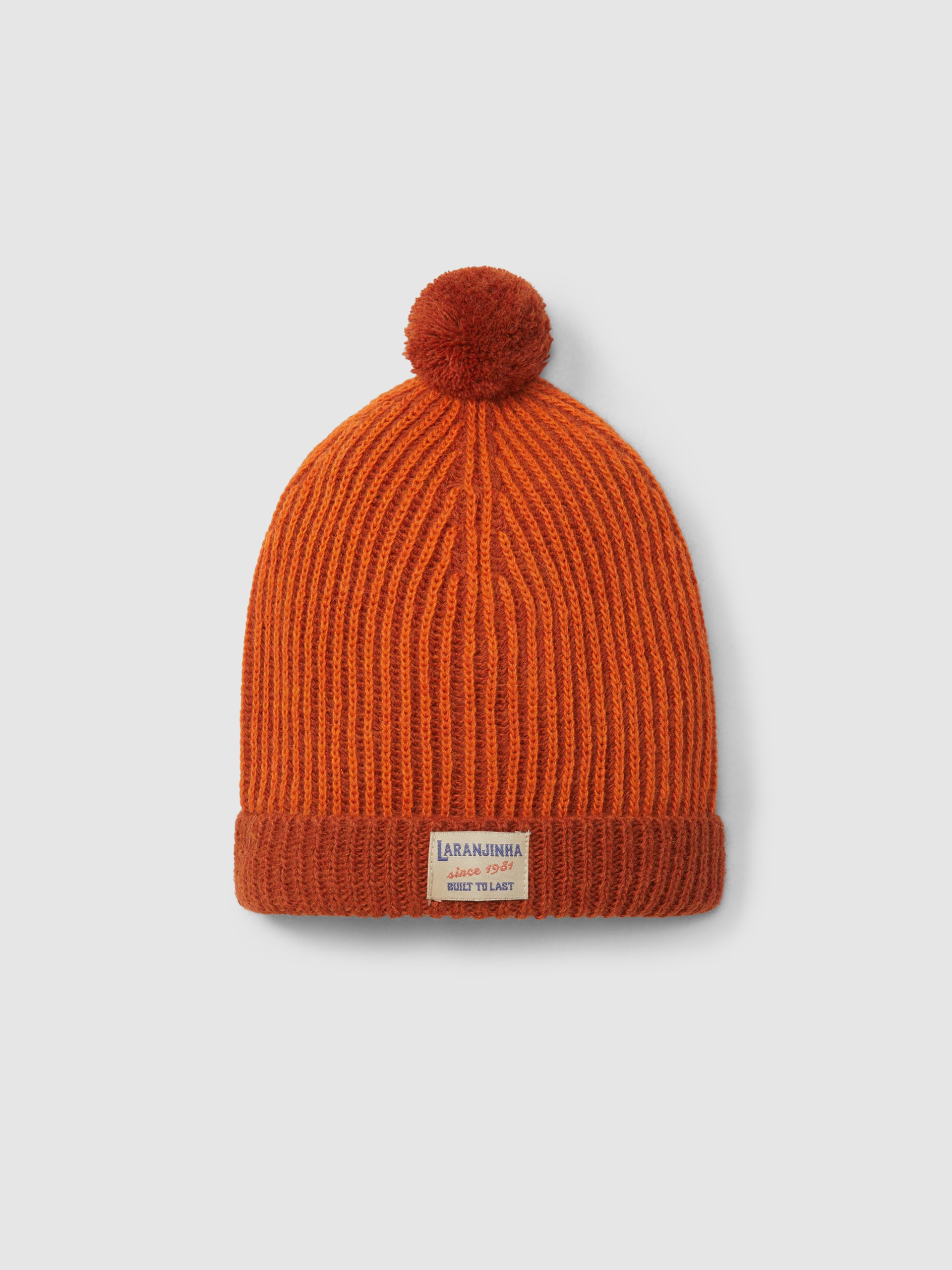 BONNET TRICOTE BICOLORE AVEC POMPON