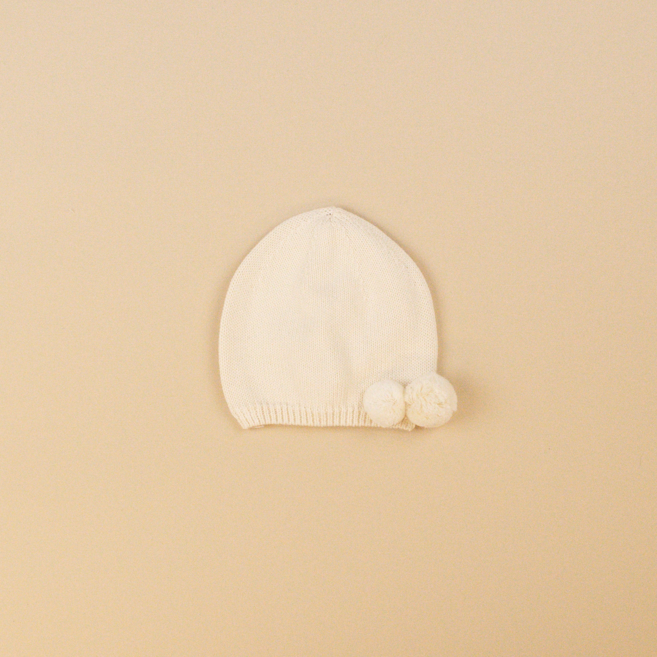 Bonnet à pompons